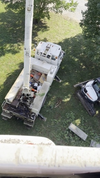 A bucket truck working close to a tree